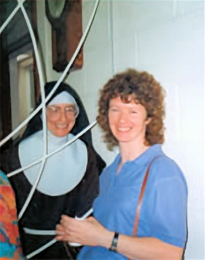 Sr. Colette-Marie of the Holy Cross with her sister at the parlour grille